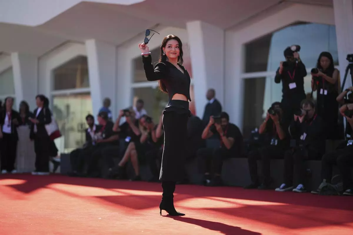 Director Shu Qi poses for photographers on the red carpet for the film 'Girl' during the 82nd edition of the Venice Film Festival in Venice, Italy, on Thursday, Sept. 4, 2025. (Photo by Alessandra Tarantino/Invision/AP)
