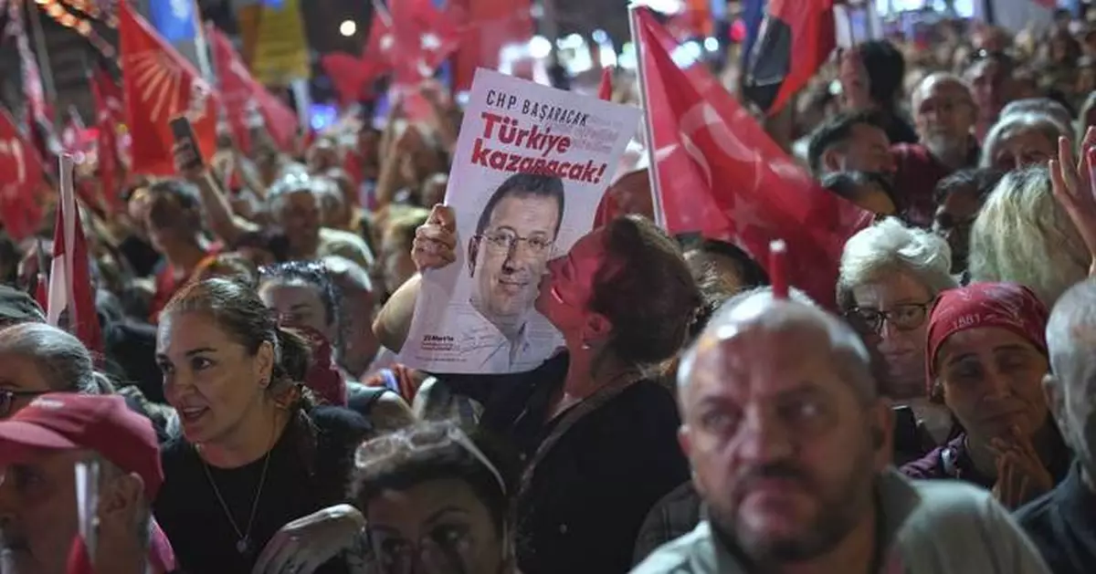 Istanbul's jailed opposition mayor greeted with cheers as he enters a prison courtroom