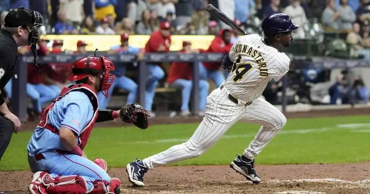 Playoff-bound Brewers rally from 5 runs down to beat skidding Cardinals 9-8 in 10 innings