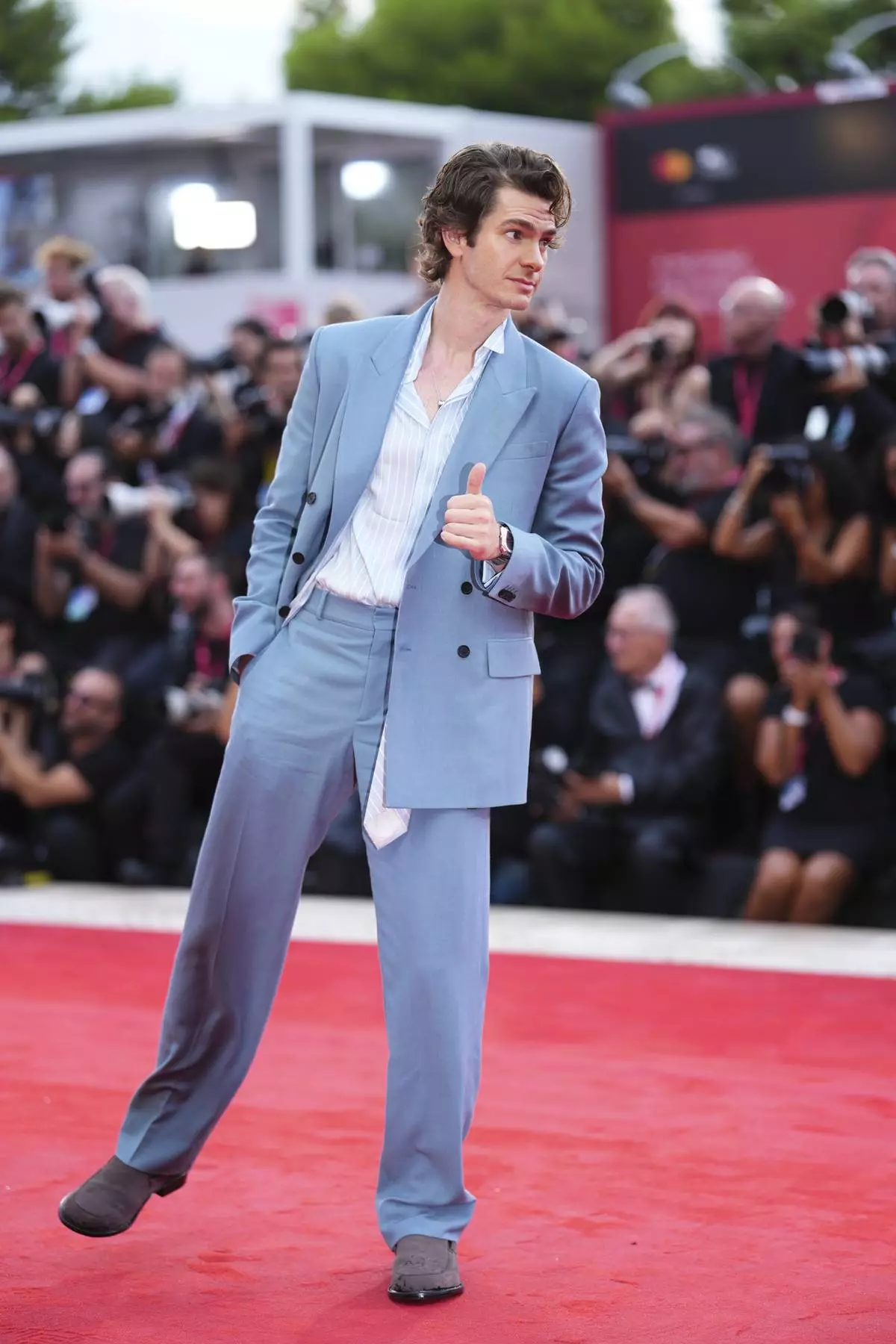 Andrew Garfield poses for photographers on the red carpet for the film 'After the Hunt' during the 82nd edition of the Venice Film Festival in Venice, Italy, on Friday, Aug. 29, 2025. (Photo by Scott A Garfitt/Invision/AP)