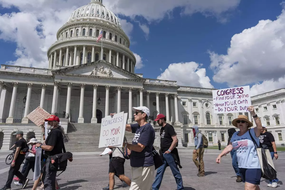 Demonstrators protest the policies of President Donald Trump, the Congress, and the delay in the Epstein investigation as lawmakers return from the August recess, at the Capitol in Washington, Tuesday, Sept. 2, 2025. (AP Photo/J. Scott Applewhite)