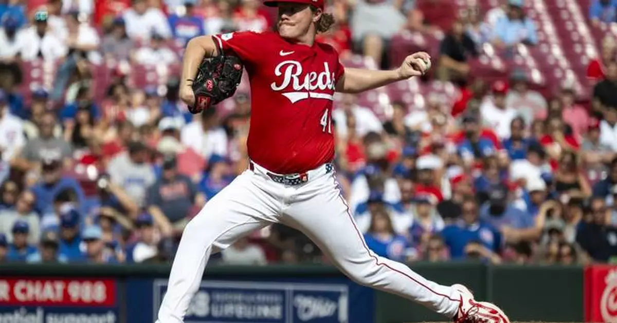 Surging Reds blank Cubs, move into tie for NL wild card spot