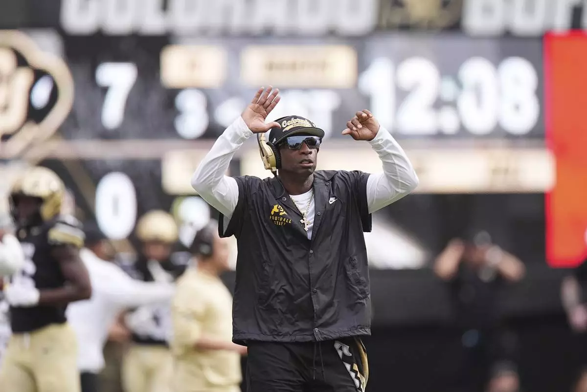 Colorado head coach Deion Sanders directs his team against Georgia Tech in the first half of an NCAA college football game Friday, Aug. 29, 2025, in Boulder, Colo. (AP Photo/David Zalubowski)