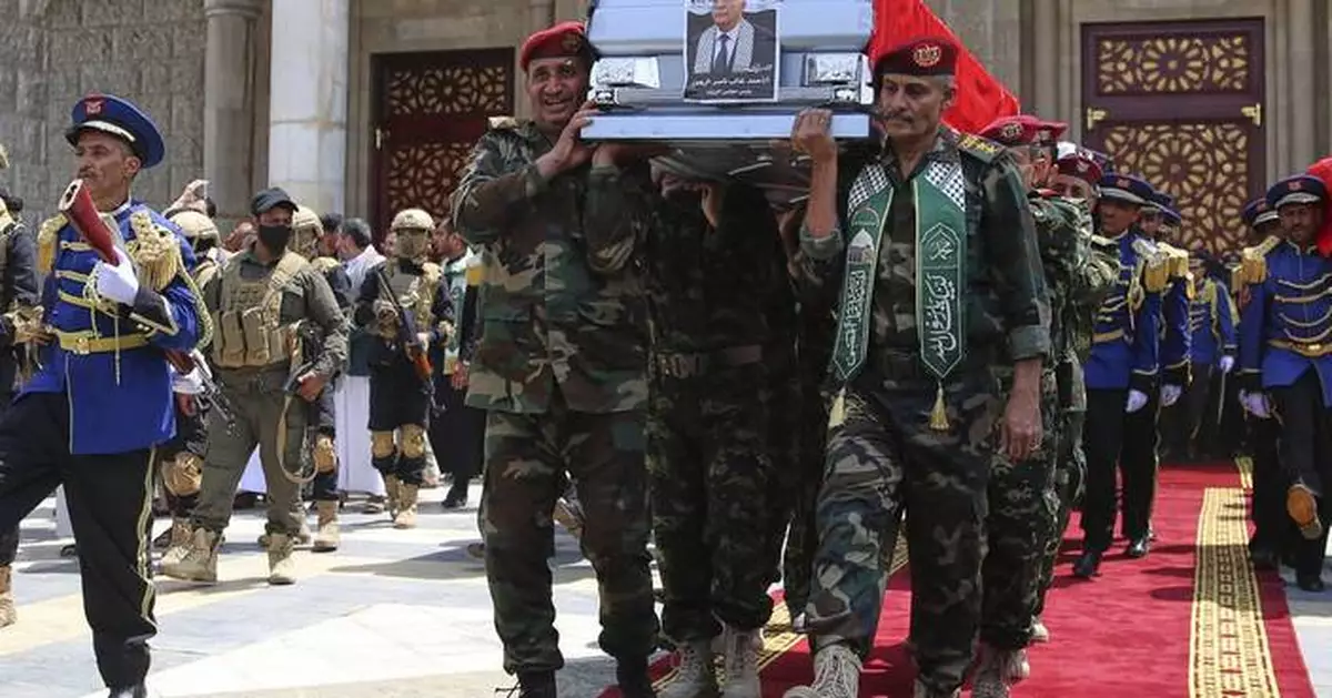 Yemenis mourn killed Houthi prime minister as rebel group targets ship in Red Sea