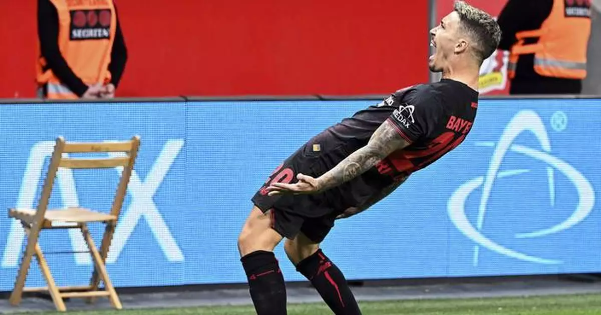 Leverkusen fights past in-form Frankfurt to earn first Bundesliga win