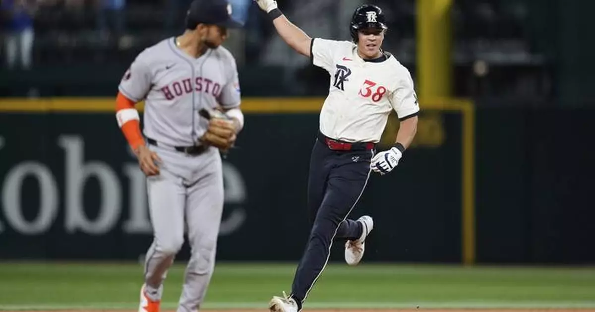 Rangers outlast AL West-leading Astros 4-3 in 12 innings to move closer to playoff spot