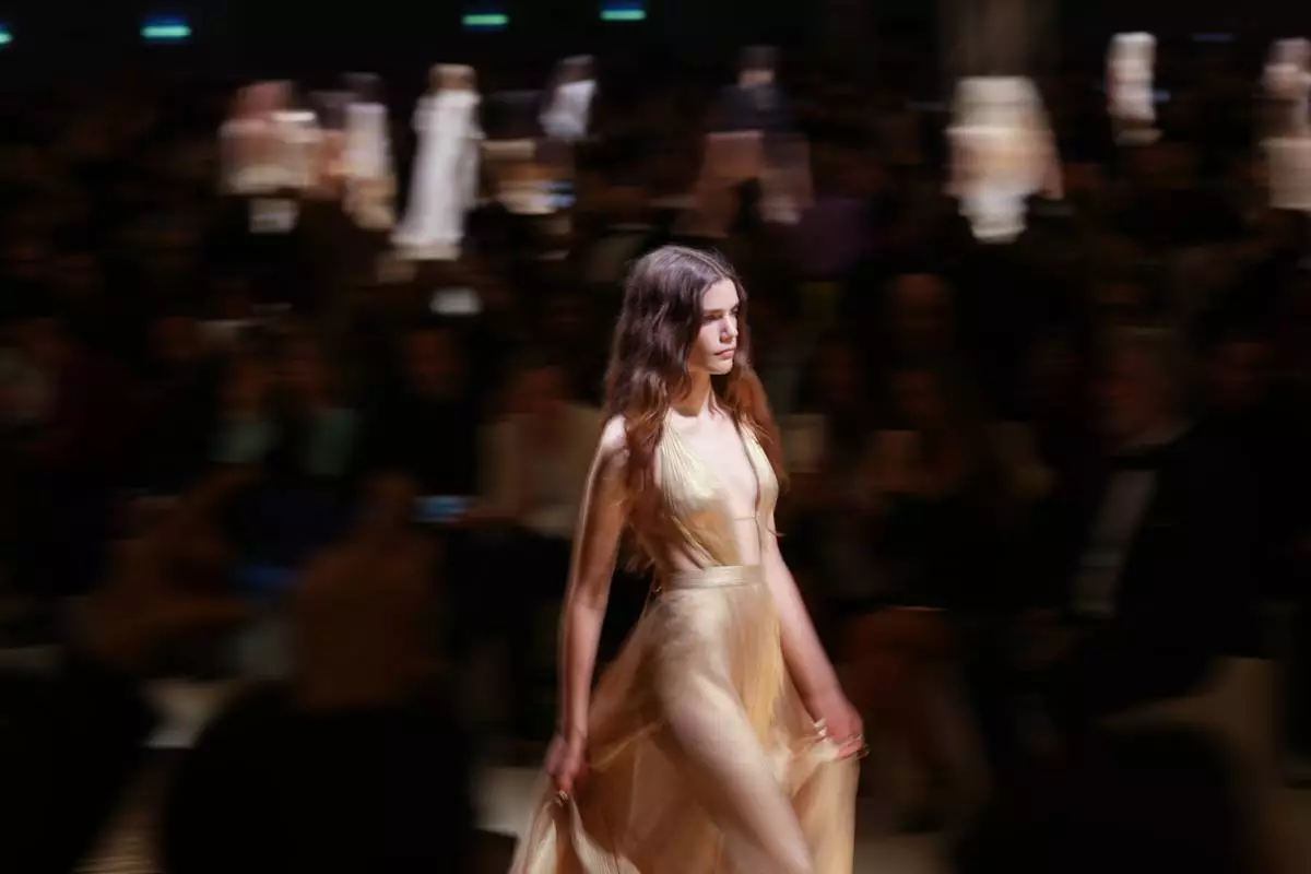 A model wears a creation as part of the Roberto Cavalli Spring/Summer 2026 collection presented in, in Milan, Thursday, Sept. 25, 2025. (AP Photo/Antonio Calanni)