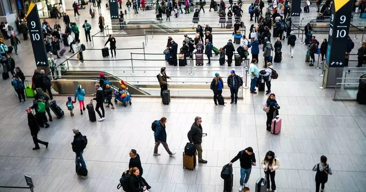 Off-duty officer shoots and wounds man inside New York City's busy Penn Station, police say