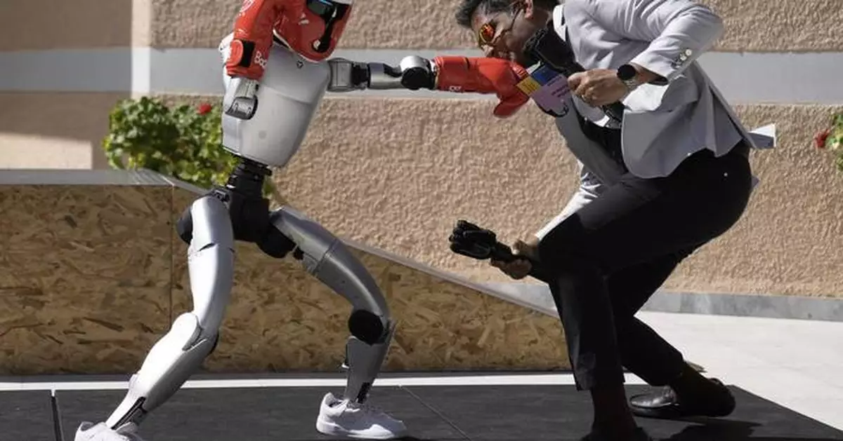 Humanoid robots showcase skills at Ancient Olympia. But they're on a long road to catch up to AI