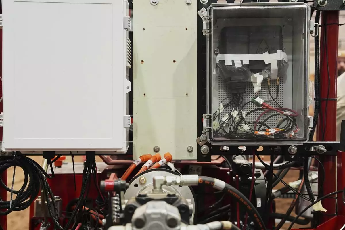 Electronics for a self-driving system sit on an electric tractor Tuesday, Aug. 19, 2025, in East Lansing, Mich. (AP Photo/Joshua A. Bickel)