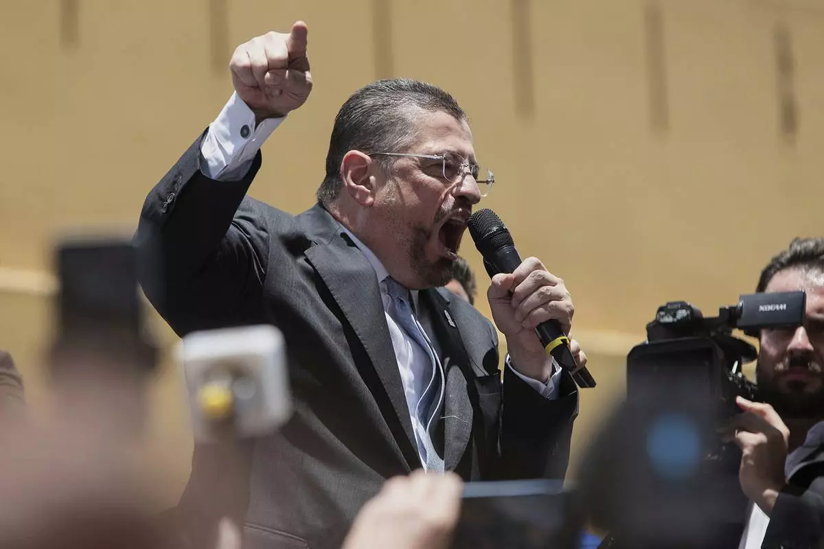FILE - Costa Rican President Rodrigo Chaves speaks to supporters after addressing a legislative committee considering a request from the Supreme Court to lift his immunity so he can stand trial on corruption charges in San Jose, Costa Rica, Aug. 22, 2025. (AP Photo/Jose Diaz, File)