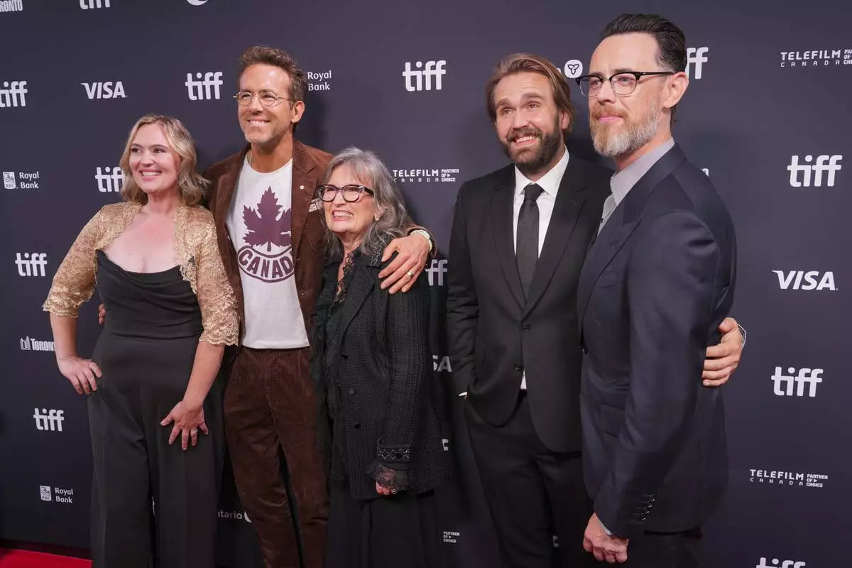 Jennifer Candy-Sullivan, from left, Ryan Reynolds, Rosemary Margaret Hobor, Chris Candy, and director Colin Hanks attend the premiere of "John Candy: I Like Me" during the Toronto International Film Festival on Thursday, Sept. 4, 2025, at Roy Thomson Hall in Toronto. (AP Photo/Chris Pizzello)
