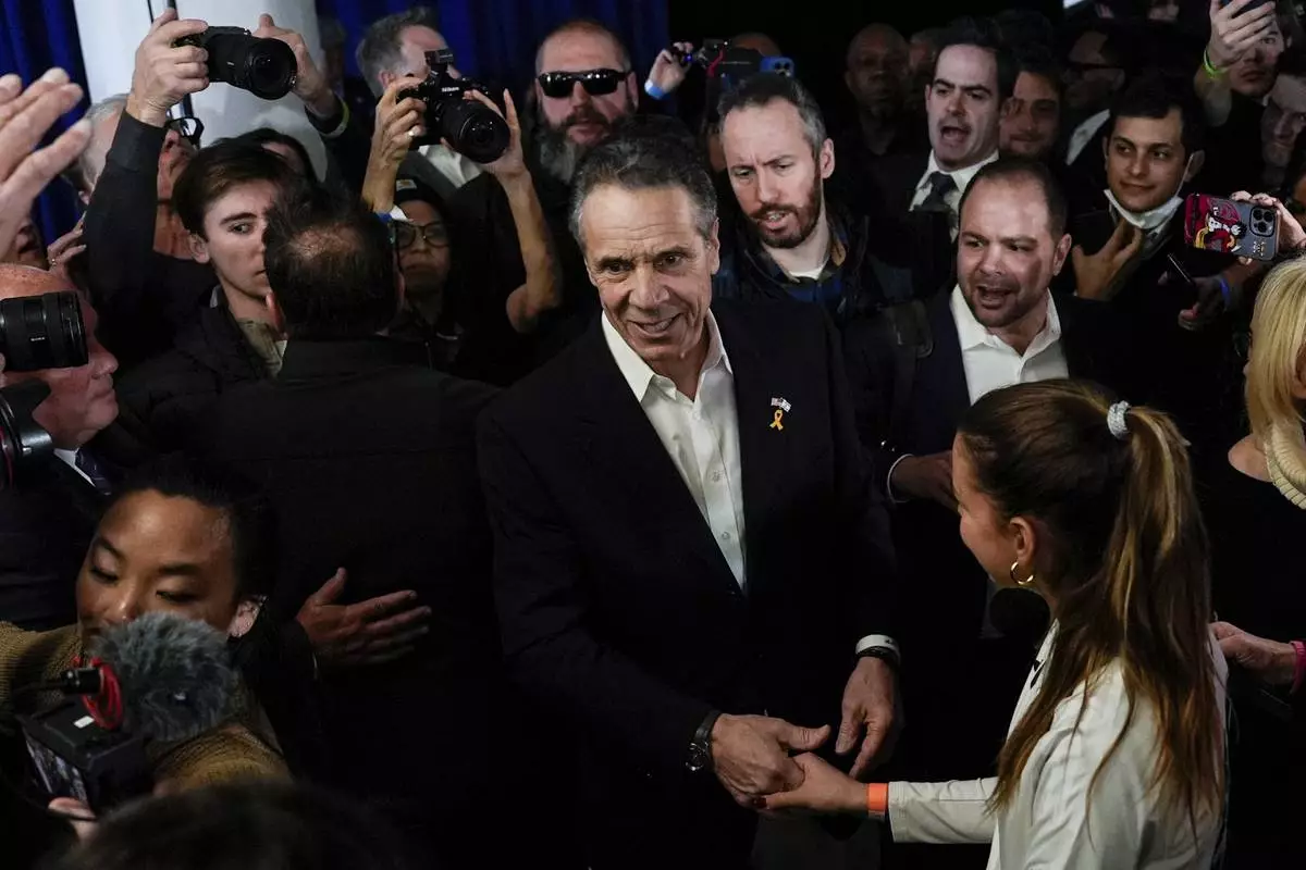 FILE - Former New York Gov. Andrew Cuomo, center, speaks with supporters at the New York City District Council of Carpenters while campaigning for mayor of New York City, March 2, 2025. (AP Photo/Julia Demaree Nikhinson, File)