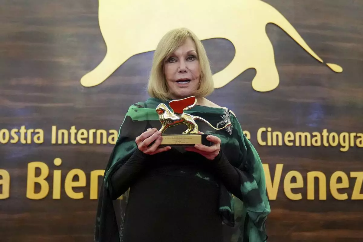 Kim Novak, recipient of the Golden Lion for lifetime achievement, poses for photographers during the 82nd edition of the Venice Film Festival in Venice, Italy, on Monday, Sept. 1, 2025. (Photo by Alessandra Tarantino/Invision/AP)