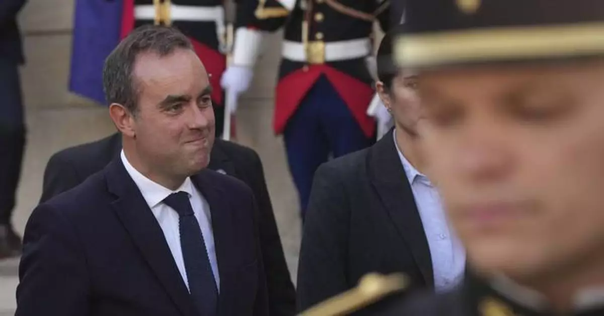 Strikes and protests roil France, pitting the streets against Macron and his new prime minister