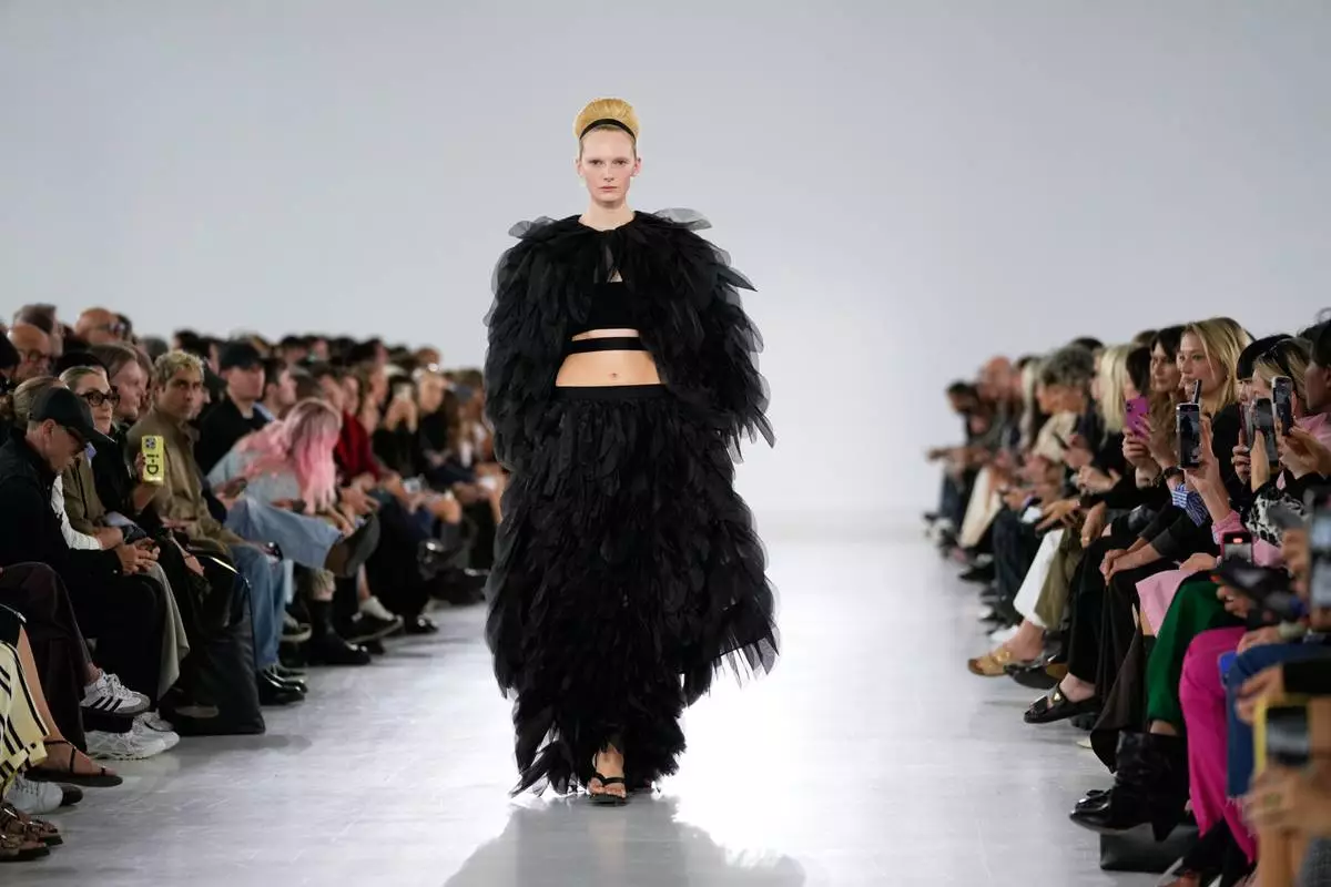 A model wears a creation part of the Max Mara women's Spring-Summer 2026 collection, presented in Milan, Italy, Thursday, Sept. 25, 2025. (AP Photo/Luca Bruno)