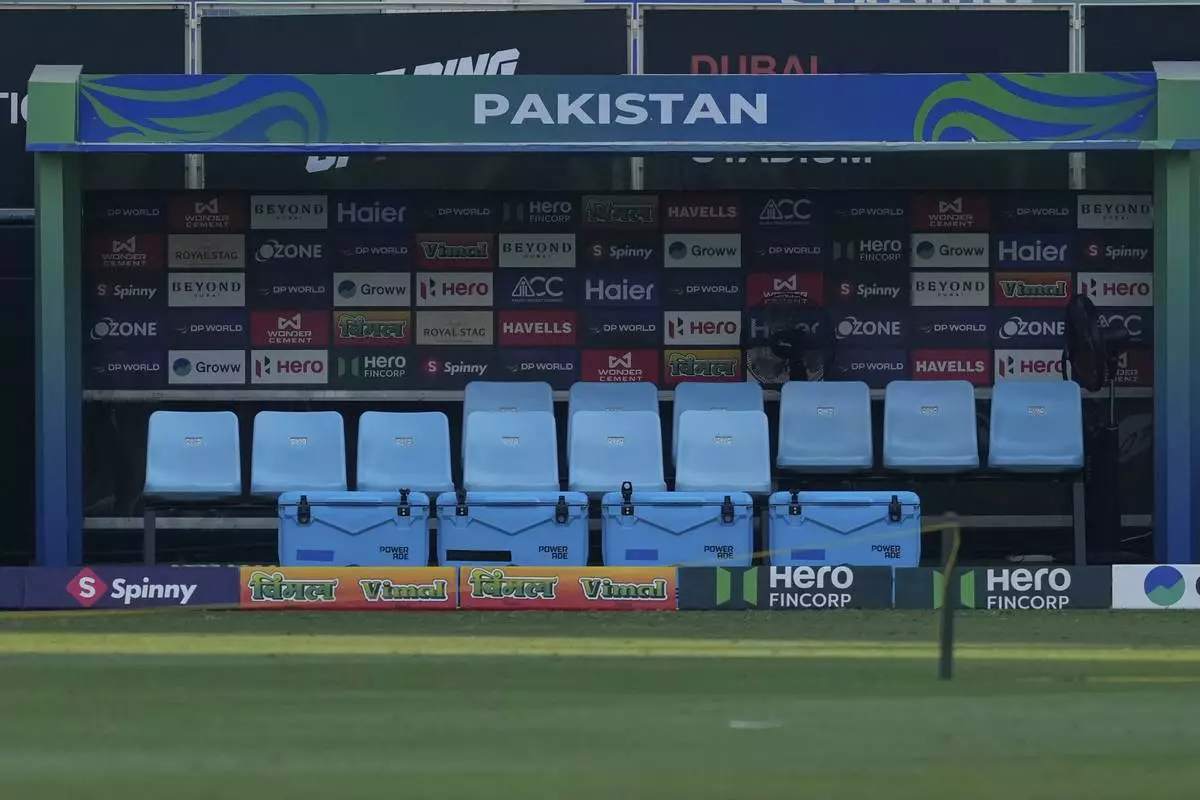 CORRECTS TO DELAYED MATCH - Empty dugout area of Pakistani players is seen after the start of Pakistan's Asia Cup cricket game against United Arab Emirates has been delayed in the fallout of a handshake dispute with India, at Dubai International Cricket Stadium, United Arab Emirates, Wednesday, Sept. 17, 2025. (AP Photo/Altaf Qadri)