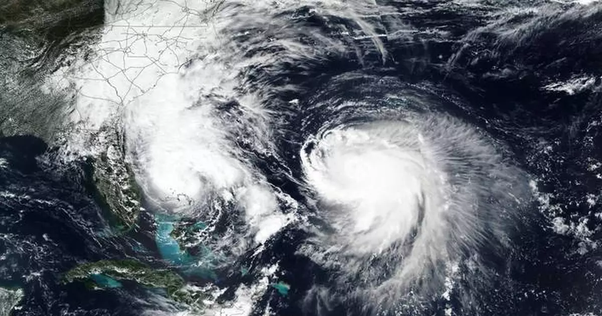 Bermuda lashed by distant hurricane and prepares for the stronger Imelda