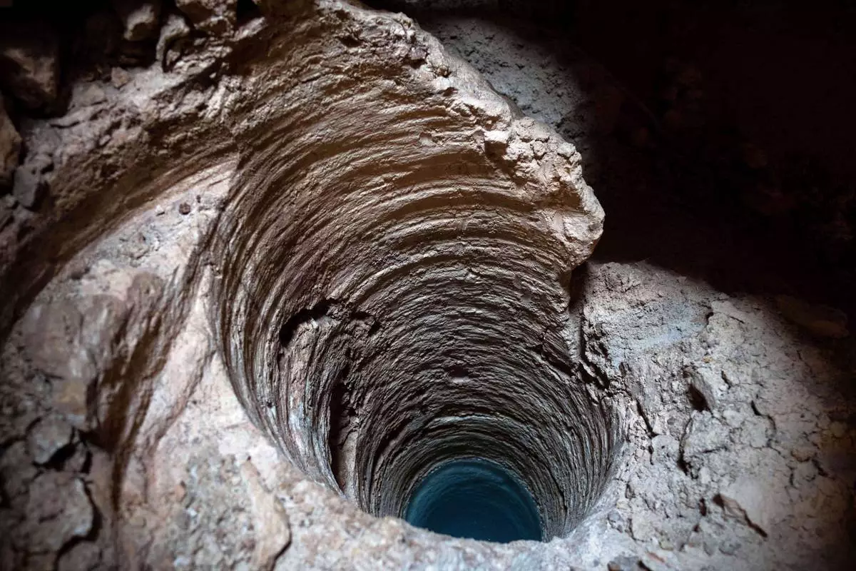 FILE PHOTO GALLERY - This hole was cut into the Aktun Tuyul cave system, made by massive metal drills to introduce a steel pillar filled with concrete that will be used to support a part of the Maya Train track, on the outskirts of Playa del Carmen, Mexico, March 1, 2024. (AP Photo/Rodrigo Abd)