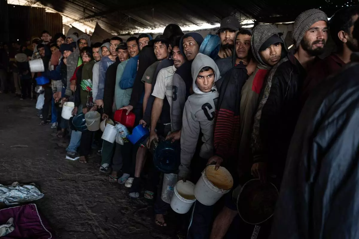 FILE PHOTO GALLERY - Inmates line up for a jail-provided meal known as "vori-vori" at the Tacumbu prison in Asuncion, Paraguay, July 10, 2024. (AP Photo/Rodrigo Abd)