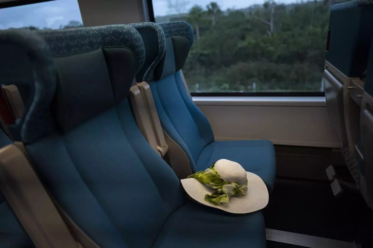 FILE PHOTO GALLERY - A passenger's hat rests on a seat of the Maya Train en route to Valladolid, Mexico, March 6, 2024. When it's completed, the high-speed Maya Train will wind around Mexico's southern Yucatan peninsula. (AP Photo/Rodrigo Abd)