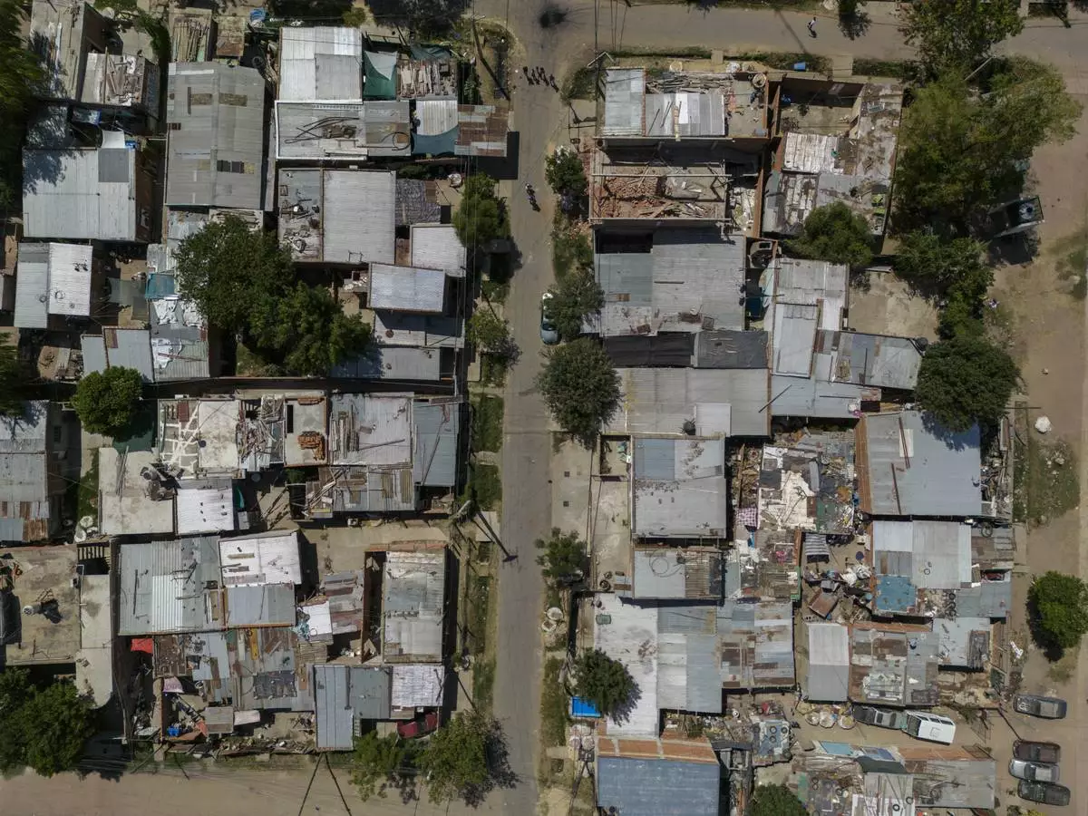 FILE PHOTO GALLERY - An aerial view of Los Pumitas neighborhood, where an 11-year-old boy was fatally shot at a birthday party in Rosario, Argentina, March 7, 2023. Three other children, including a 2-year-old, were injured during the attack. (AP Photo/Rodrigo Abd)