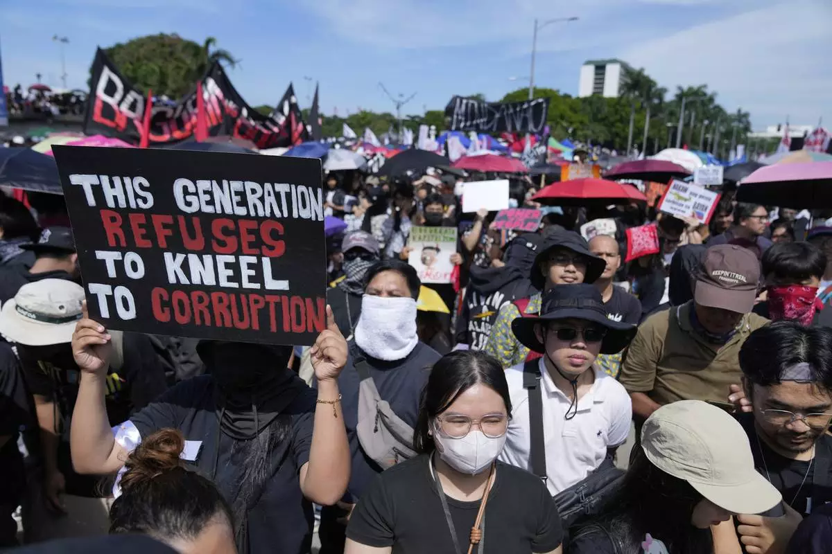 Protesters gather during an anti-corruption rally at Manila's Rizal Park, Philippines on Sunday, Sept. 21, 2025. (AP Photo/Aaron Favila)