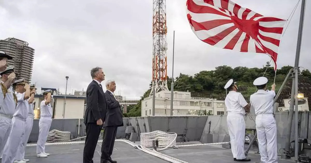 Australia's defense minister visits a frigate in Japan as the countries boost defense ties