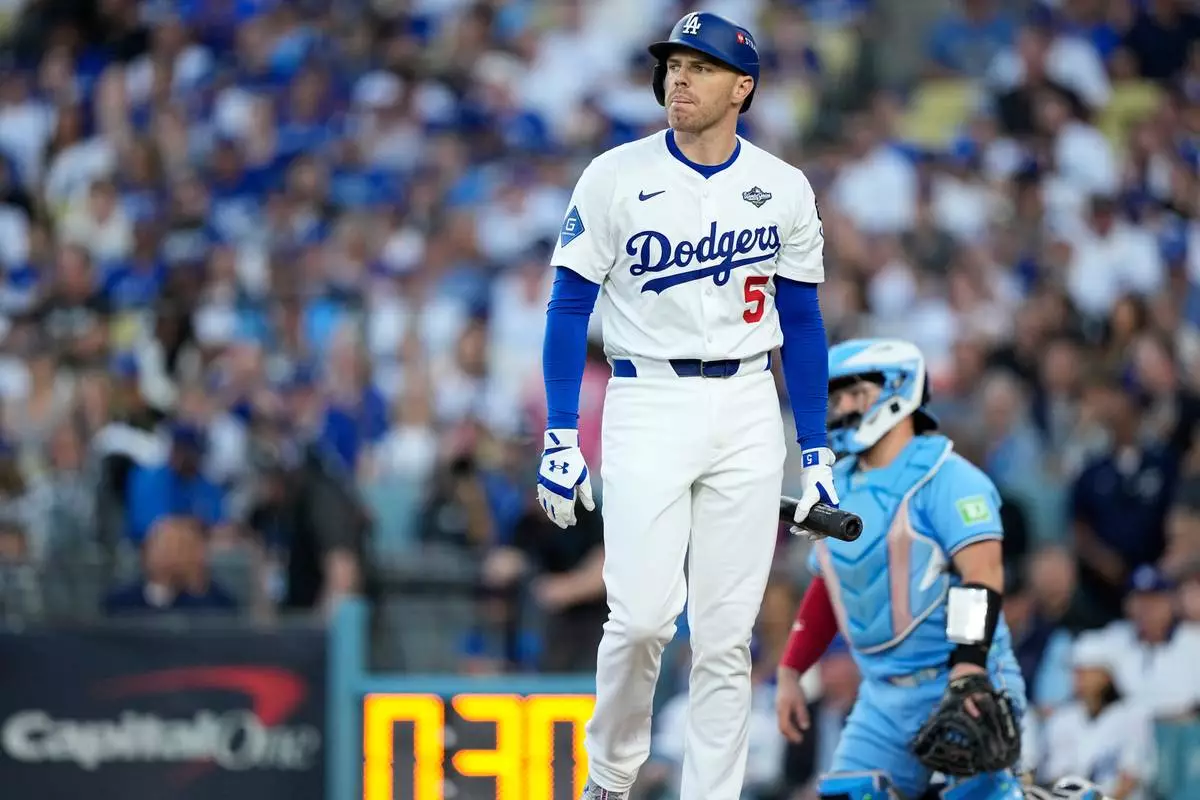 Los Angeles Dodgers' Freddie Freeman walks to the dugout after striking out against the Toronto Blue Jays during the second inning in Game 5 of baseball's World Series, Wednesday, Oct. 29, 2025, in Los Angeles. (AP Photo/Brynn Anderson)