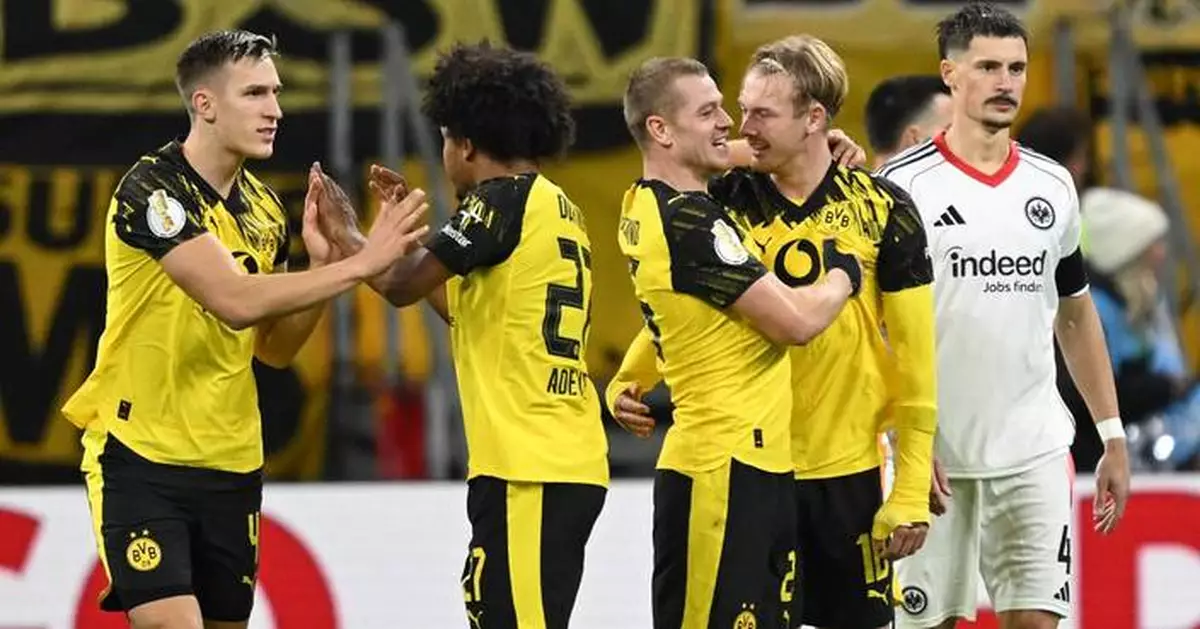 Kobel makes a vital save as Dortmund beats Frankfurt on penalties in German Cup
