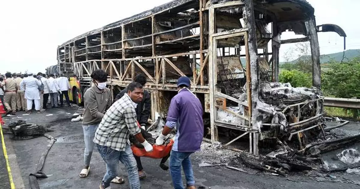 Bus catches fire after being hit by a motorcycle in southern India, killing at least 25