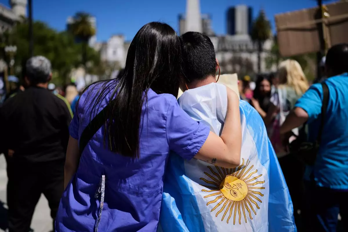 People protest demanding the government of President Javier Milei enact a bill expanding protections for people with disabilities, in Buenos Aires, Argentina, Wednesday, Oct. 1, 2025. (AP Photo/Natacha Pisarenko)