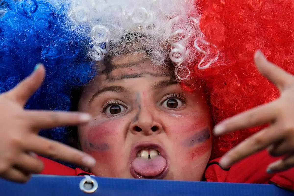A child poses for a photo prior to a FIFA U-20 World Cup Group A soccer match between Chile and New Zealand at National Stadium in Santiago, Chile, Saturday, Sept. 27, 2025. (AP Photo/Matias Delacroix)