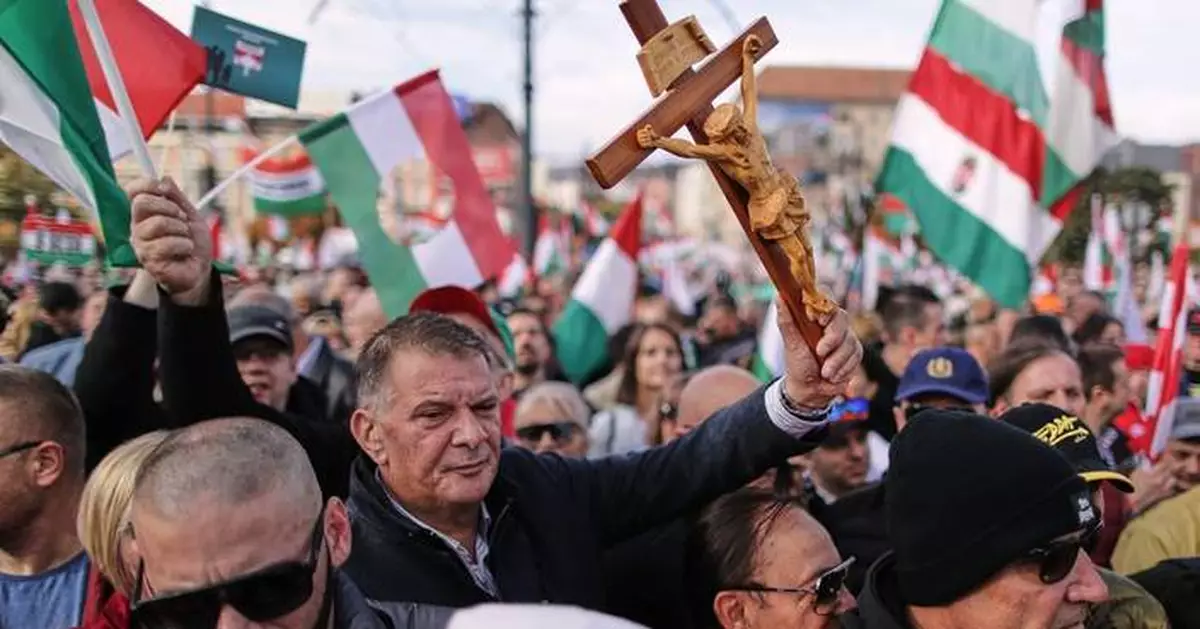 Hundreds of thousands of Hungarians attend rival rallies in Budapest as Orbán faces election test