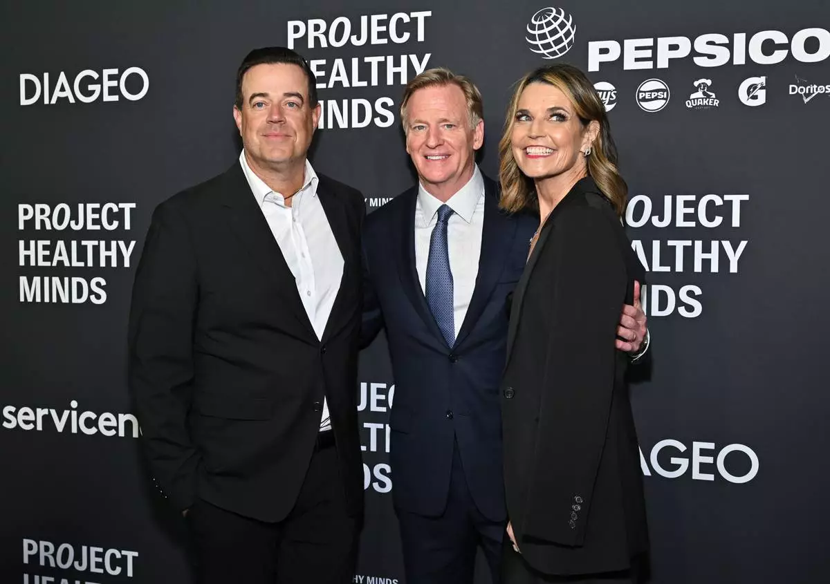 Carson Daly, left, Roger Goodell and Savannah Guthrie attend the third annual World Mental Health Day Gala, hosted by Project Healthy Minds, at Spring Studios on Thursday, Oct. 9, 2025, in New York. (Photo by Evan Agostini/Invision/AP)