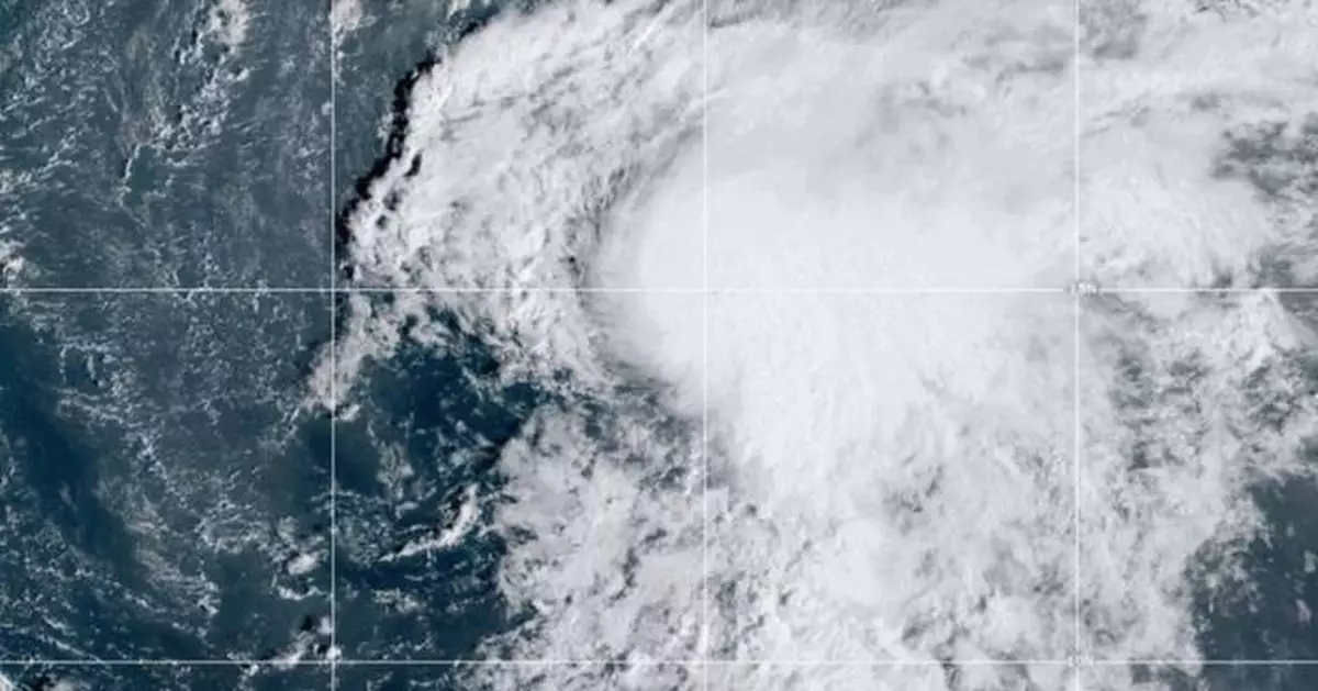 Tropical Storm Lorenzo weakens over open water in the Atlantic Ocean