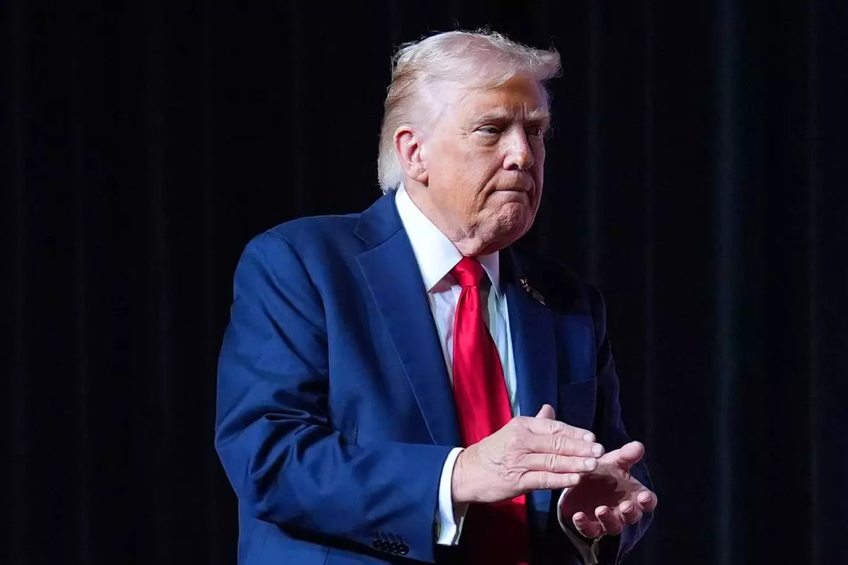 President Donald Trump walking off stage after speaking to a gathering of top U.S. military commanders at Marine Corps Base Quantico, Tuesday, Sept. 30, 2025, in Quantico, Va. (AP Photo/Evan Vucci)