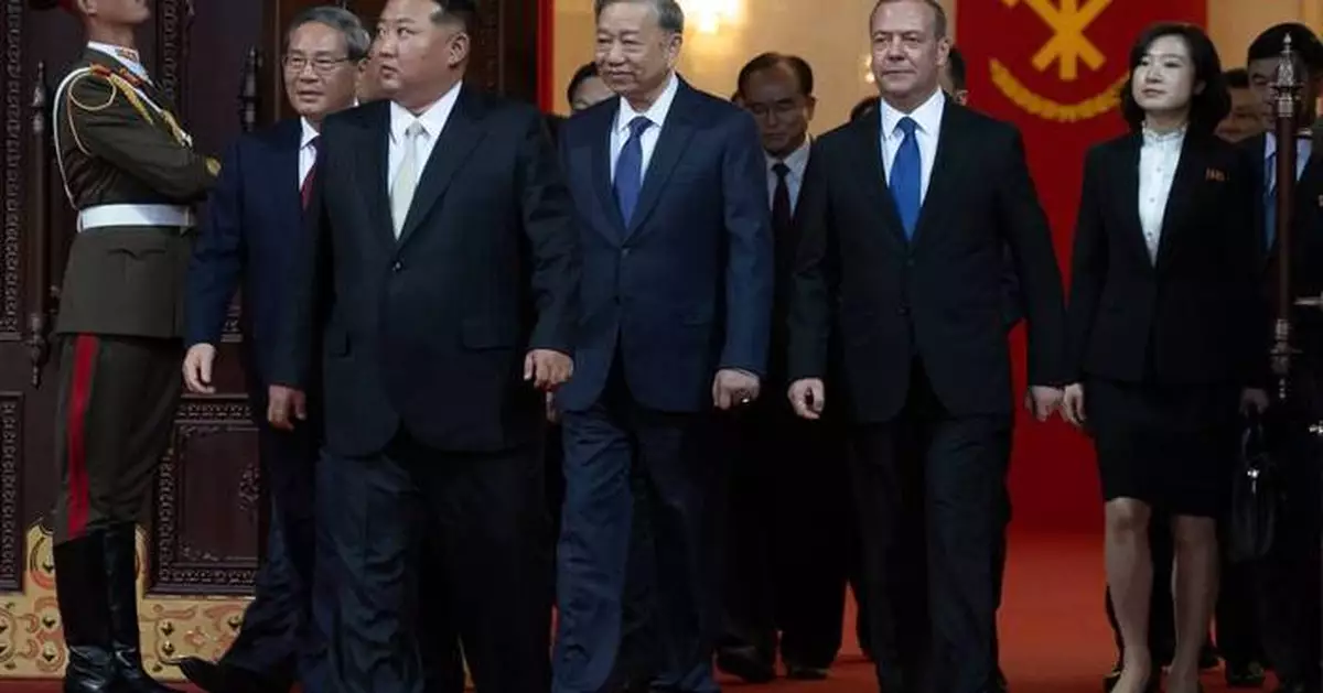 North Korea displays new long-range missile at a military parade celebrating Kim Jong Un