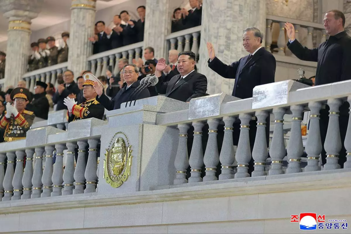 In this photo provided by North Korean government, North Korean leader Kim Jong Un, third right, Chinese Premier Li Qiang, fourth right, Vietnamese Communist Party General Secretary To Lam, second right, Russian Security Council Deputy Chairman Dmitry Medvedev, right, attend the military parade marking the 80th anniversary of the founding of the ruling Worker's Party, in Pyongyang, North Korea, Friday, Oct. 10, 2025. Independent journalists were not given access to cover the event depicted in this image distributed by the North Korean government. The content of this image is as provided and cannot be independently verified. Korean language watermark on image as provided by source reads: "KCNA" which is the abbreviation for Korean Central News Agency. (Korean Central News Agency/Korea News Service via AP)