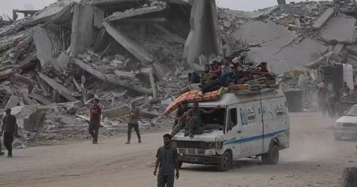 The Latest: Palestinians journey back home as aid convoys enter Gaza and truce holds