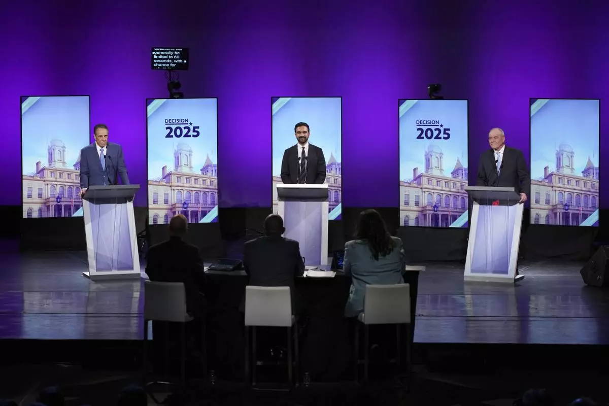 From left, Independent candidate former New York Gov. Andrew Cuomo, Democratic candidate Assemblyman Zohran Mamdani and Republican candidate Curtis Sliwa participate in a second New York City mayoral debate at LaGuardia Performing Arts Center at LaGuardia Community College in the Queens borough of New York, Wednesday, Oct. 22, 2025. (Hiroko Masuike/The New York Times via AP, Pool)