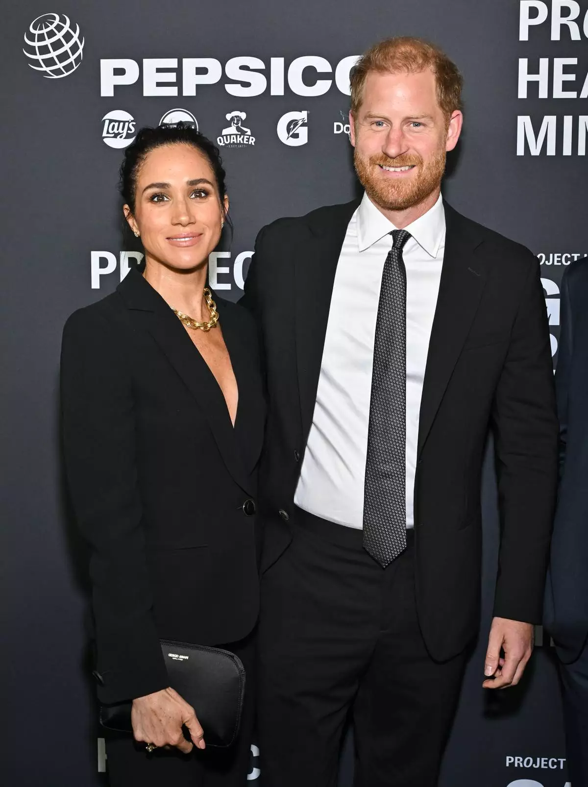Meghan Markle, left, and Prince Harry, The Duke and Duchess of Sussex, attend the third annual World Mental Health Day Gala, hosted by Project Healthy Minds, at Spring Studios on Thursday, Oct. 9, 2025, in New York. (Photo by Evan Agostini/Invision/AP)