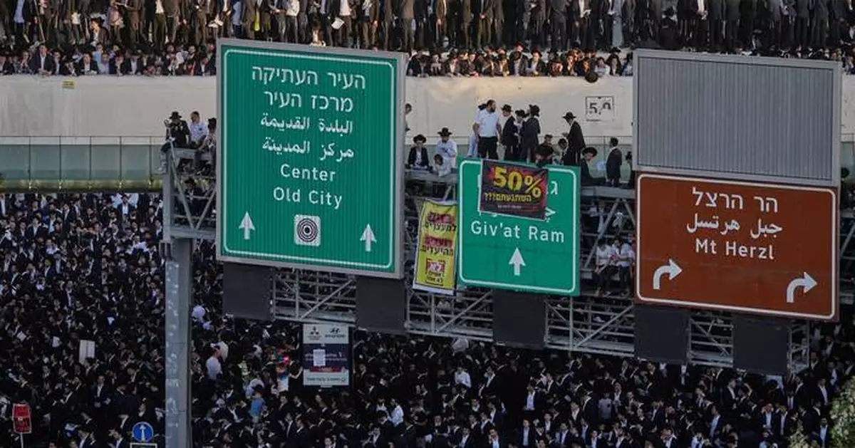 Photos show thousands of ultra-Orthodox men protesting military draft shut down Jerusalem