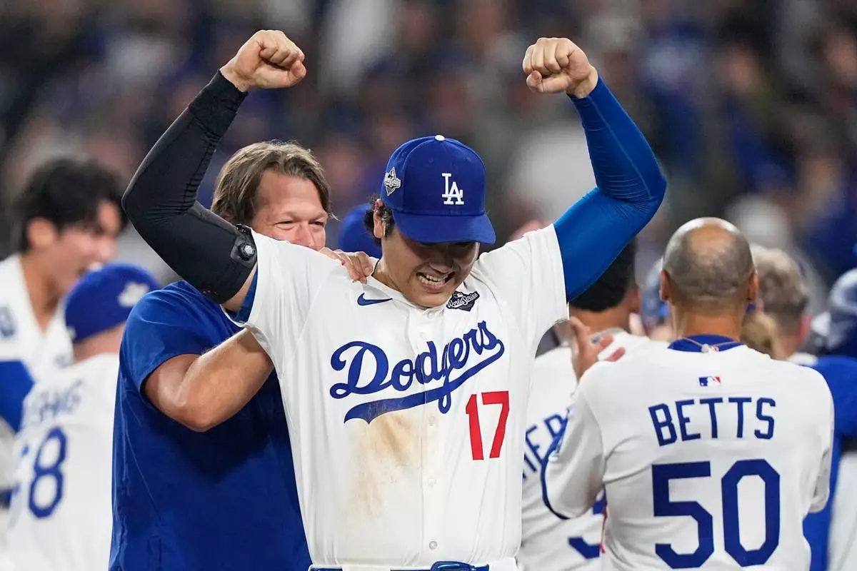 Los Angeles Dodgers' Shohei Ohtani celebrates their win against the Toronto Blue Jays during the 18th inning in Game 3 of baseball's World Series, Monday, Oct. 27, 2025, in Los Angeles. (AP Photo/Brynn Anderson)