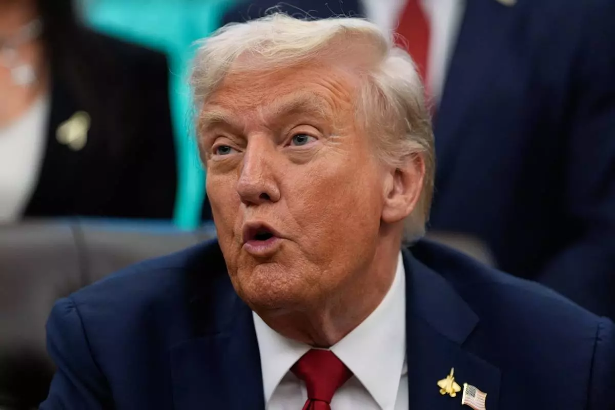 President Donald Trump speaks in the Oval Office of the White House before signing an executive order regarding childhood cancer and the use of AI, Tuesday, Sept. 30, 2025, in Washington. (AP Photo/Alex Brandon)