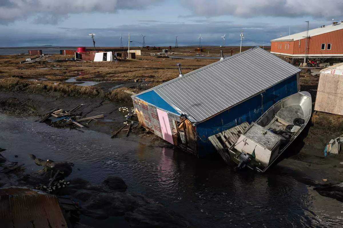 A home is left damaged in Kipnuk, Alaska, on a stream bank after the remnants of Typhoon Halong caused widespread destruction in the coastal village in Western Alaska, Friday, Oct. 17, 2025. (Marc Lester/Anchorage Daily News via AP)