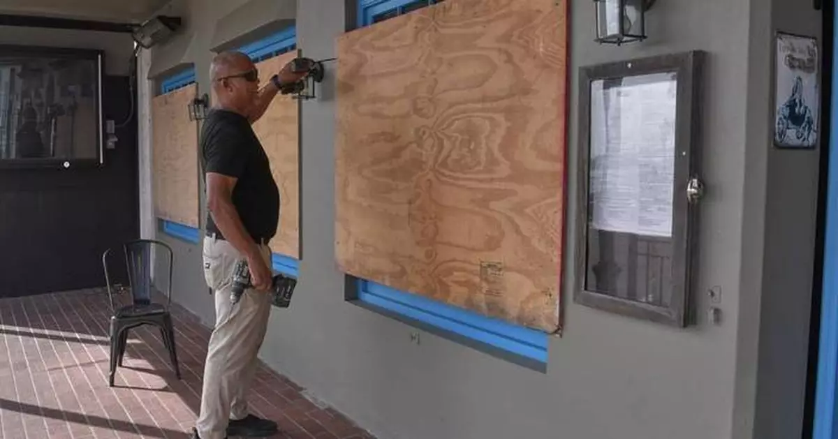 Imelda weakens after downing trees and power lines in Bermuda as a hurricane