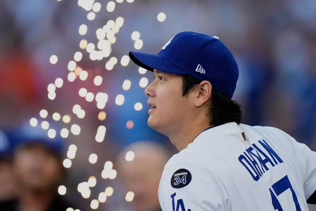 Los Angeles Dodgers' Shohei Ohtani is introduced before Game 3 of baseball's World Series against the Toronto Blue Jays, Monday, Oct. 27, 2025, in Los Angeles. (AP Photo/Brynn Anderson)
