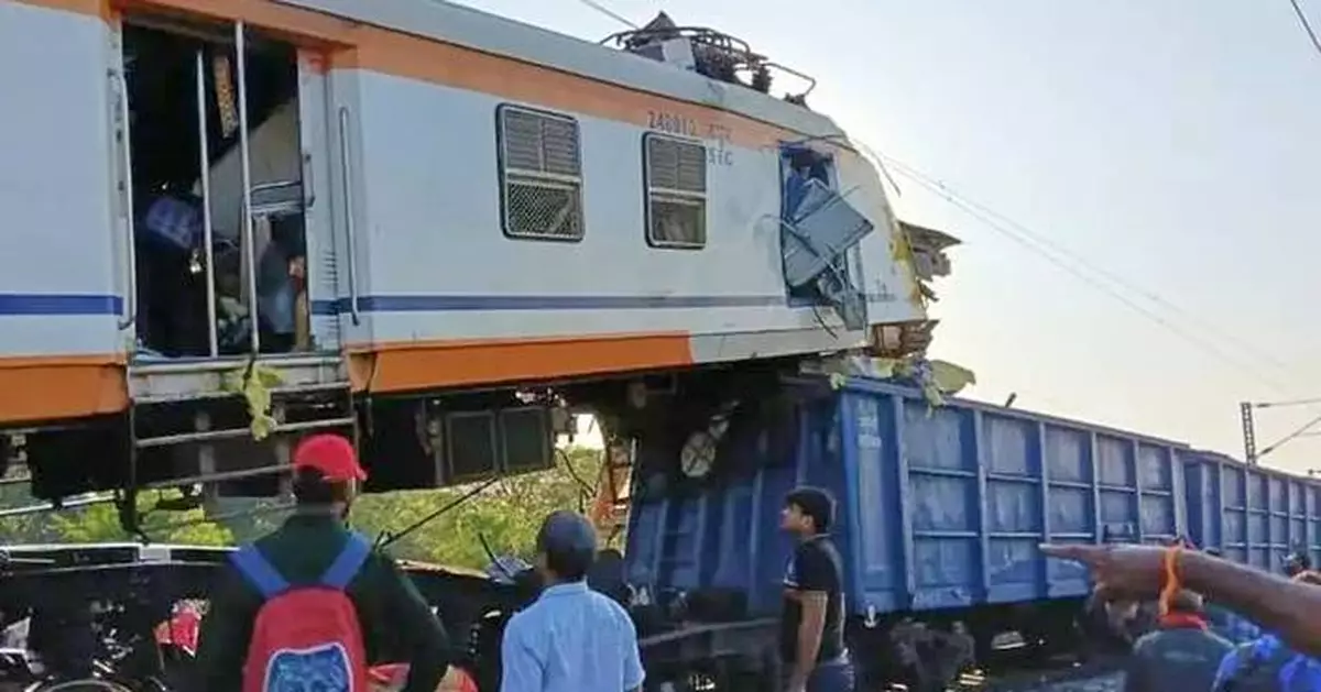 Passenger train collides with cargo train in central India, killing at least 11