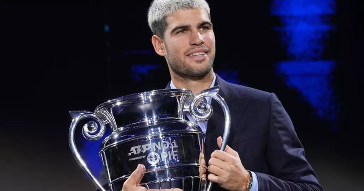 Carlos Alcaraz beams with pride as he lifts trophy for year-end No. 1 player
